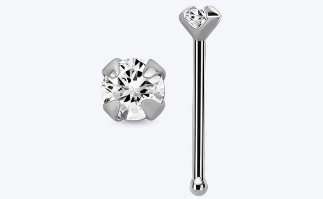 A silver colored nose bone stud with a prong set transparent crystal top