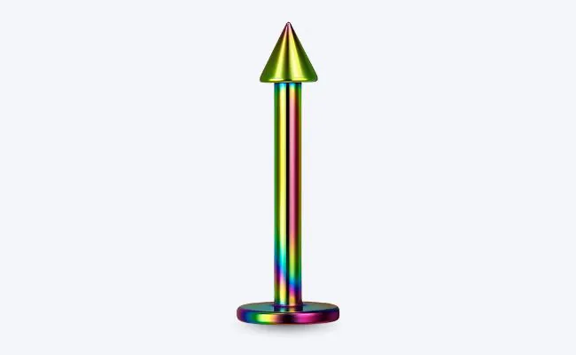 An anodized titanium flat back labret with spike top