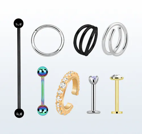 A variety of Helix jewellery like barbells, labrets and rings made of different materials