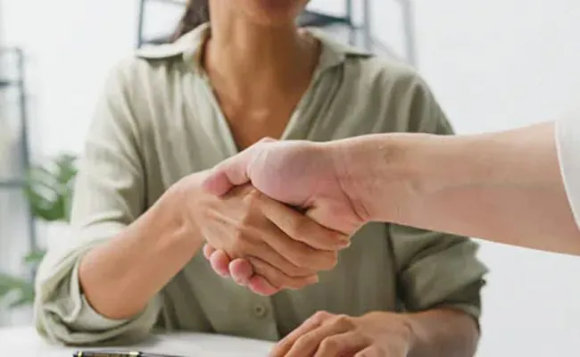 Two people shaking hands