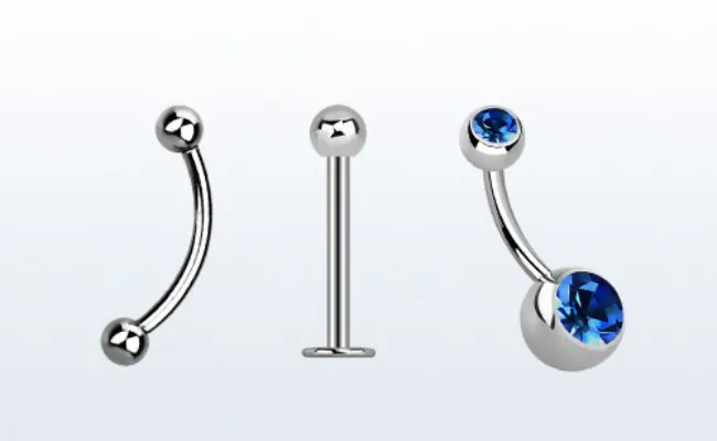 three different types of piercing jewellery with and without gemstones