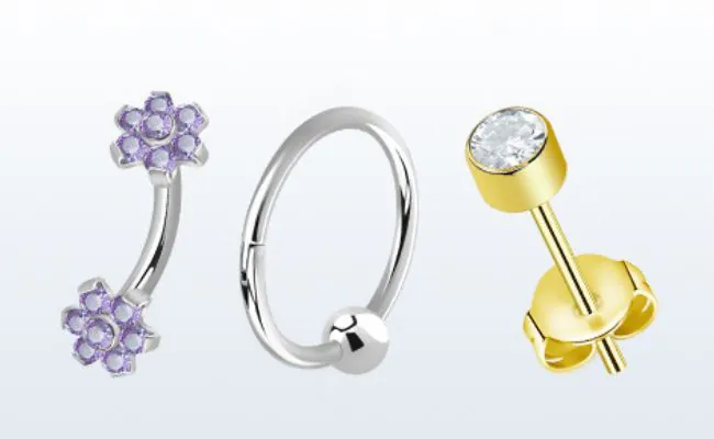 Three pieces of piercing jewellery in various designs and made of different materials