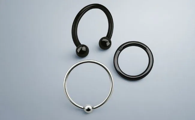 Three different types of body jewellery used for daith piercings