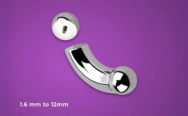 A curved barbell with an unscrewed ball that can be used as intimate jewellery