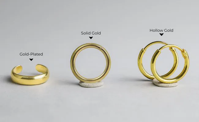 Three gold piercing rings in solid gold, hollow gold and with gold plating