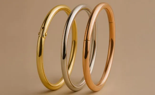 Three gold nose rings made of yellow, white and red gold