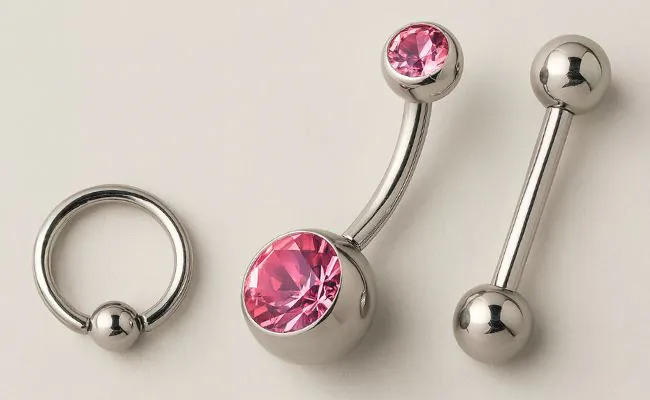 Three different types of piercing jewellery including barbells and a captive bead ring