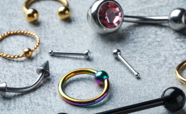 Various types of piercing jewellery in different designs and materials